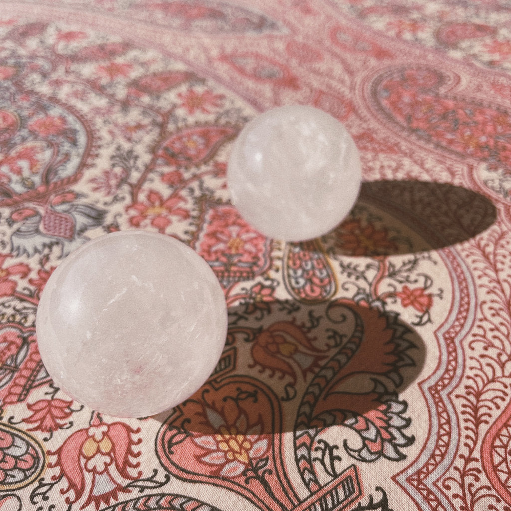 2 clear quartz balls of Akasha blends on a nice pattern background