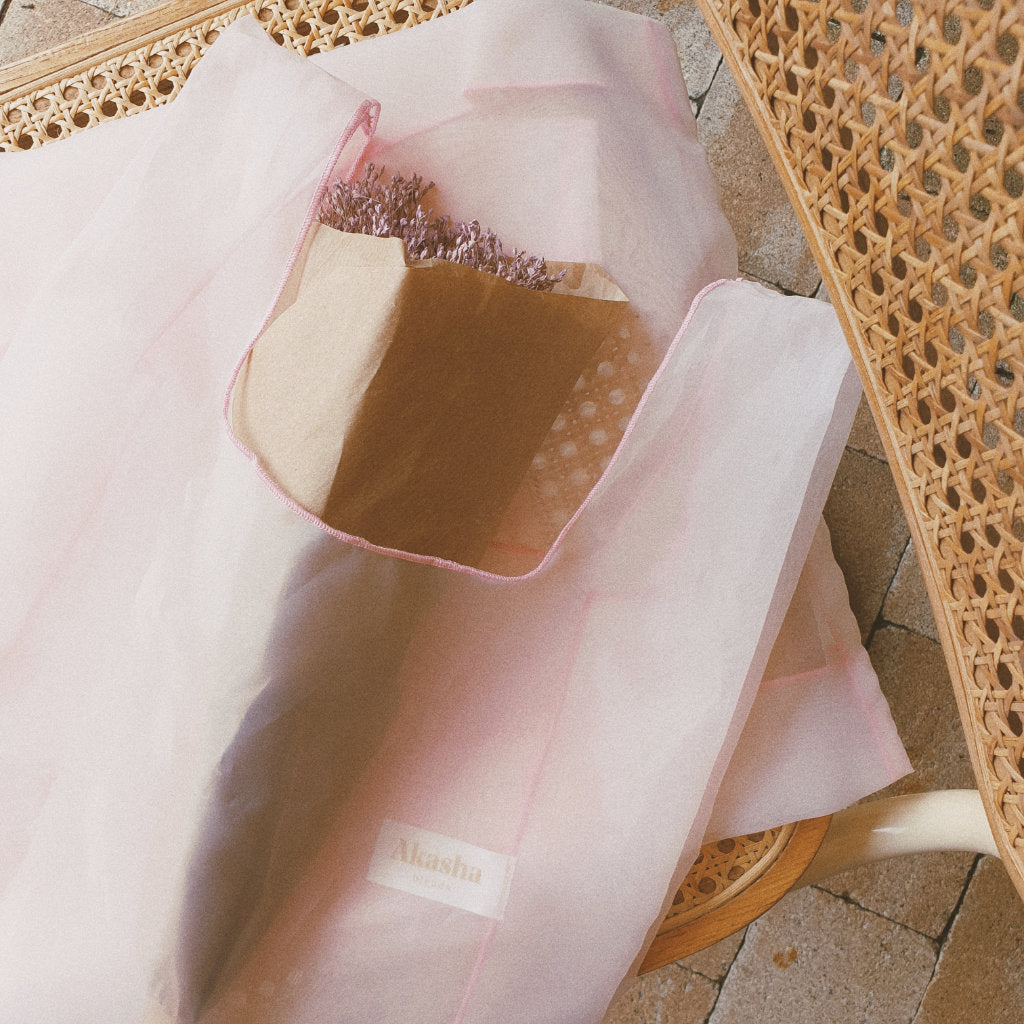 Organza bag with dried flowers on chair